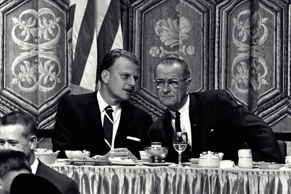 President Lyndon B. Johnson seated with Billy Graham at the Prayer Breakfast